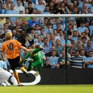 Dramatic Volley at City of Manchester Stadium: Andrew Keogh's Post-Hit Missile for Wolverhampton Wanderers vs. Manchester City, Premier League (August 22, 2009)