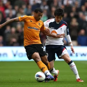 Ferocious Battle for Ball Possession: Wolverhampton Wanderers vs. Bolton Wanderers in the Premier League