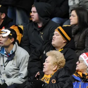 A Festive Showdown: Wolverhampton Wanderers vs Birmingham City - Woman in Santa Hat