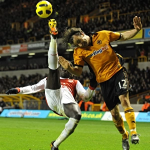 High Stakes Showdown: Wolverhampton Wanderers vs. Arsenal - Aerial Battle: Hunt vs. Sagna