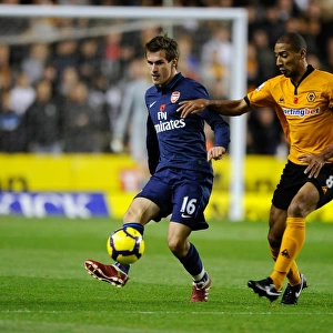 Intense Rivalry: Aaron Ramsey vs. Karl Henry Clash in Wolverhampton Wanderers vs. Arsenal Premier League Soccer Match