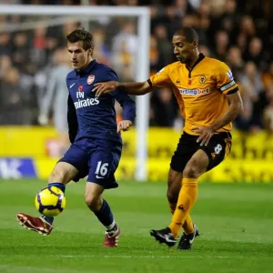 Intense Rivalry: Aaron Ramsey vs. Karl Henry Clash in Wolverhampton Wanderers vs. Arsenal Premier League Soccer Match Intense Rivalry: Aaron Ramsey vs. Karl Henry Clash in Wolverhampton Wanderers vs. Arsenal Premier League Soccer Match