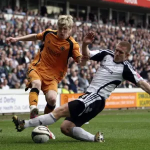 Intense Rivalry: Keogh vs. Albrechtsen Clash in Wolverhampton Wanderers vs Derby County Championship Match, 2009