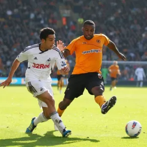 Intense Rivalry: Neil Taylor vs. Sylvan Ebanks-Blake - A Moment of Passion in Wolverhampton Wanderers vs. Swansea City Football Match