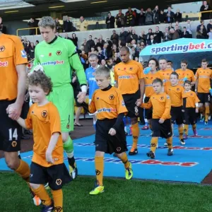 Mascot Clash: Wolves vs Wigan Athletic in the Barclays Premier League