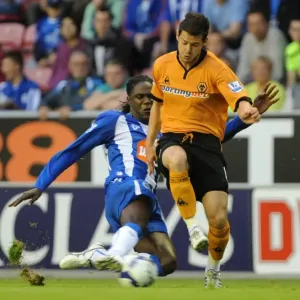Matthew Jarvis vs Mario Melchiot: Intense Clash Between Wolverhampton Wanderers and Wigan Athletic, Barclays Premier League, August 18, 2009 - DW Stadium