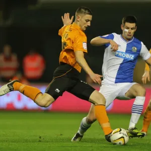 Tense Moment: Jake Cassidy's Goal Attempt Thwarted by Scott Dann (Wolverhampton Wanderers vs. Blackburn Rovers)