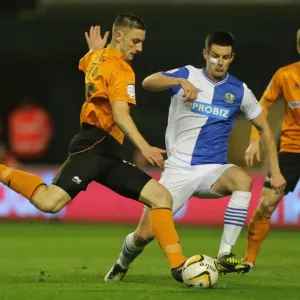 Tense Moment: Jake Cassidy's Goal Attempt Thwarted by Scott Dann (Wolverhampton Wanderers vs. Blackburn Rovers)
