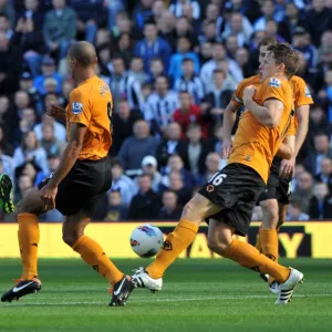 Tense Showdown: Tchoyi's Shot Thwarted by Henry and Berra (WBA vs. Wolverhampton Wanderers)