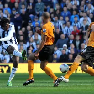 Tense Showdown: Tchoyi's Shot Thwarted by Henry and Berra (WBA vs. Wolverhampton Wanderers) Tense Showdown: Tchoyi's Shot Thwarted by Henry and Berra (WBA vs. Wolverhampton Wanderers)