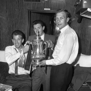 Wolverhampton Wanderers FA Cup Victory: Peter Broadbent, Gerry Mannion, and Malcolm Finlayson Celebrate on the Train Back to Wolverhampton Wolverhampton Wanderers FA Cup Victory: Peter Broadbent, Gerry Mannion, and Malcolm Finlayson Celebrate on the Train Back to Wolverhampton