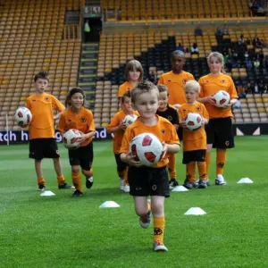Wolverhampton Wanderers Matchday Mascots Training on the Pitch: Wolves vs Real Zaragoza Wolverhampton Wanderers Matchday Mascots Training on the Pitch: Wolves vs Real Zaragoza