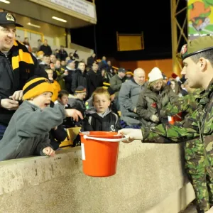 Wolverhampton Wanderers: Soldier Collects Donations in Billy Wright Stand During Wolves vs. Arsenal Premier League Game Wolverhampton Wanderers: Soldier Collects Donations in Billy Wright Stand During Wolves vs. Arsenal Premier League Game