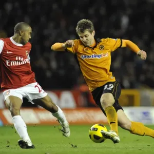 Wolverhampton Wanderers vs Arsenal: Intense Encounter between Kevin Doyle and Gael Clichy in the Premier League