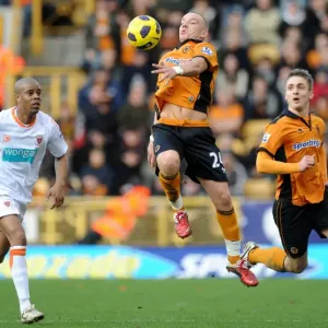 Wolverhampton Wanderers vs Blackpool: Jamie O'Hara and Kevin Doyle in Action - Barclays Premier League Soccer: Intense Moment between O'Hara and Doyle