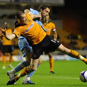 Wolverhampton Wanderers vs Doncaster Rovers: FA Cup Clash - David Jones vs Mark Wilson: A Battle at the Heart of the Field