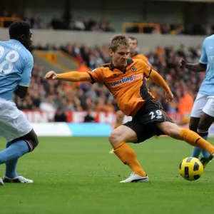 Wolverhampton Wanderers vs Manchester City: A Battle Between Kevin Doyle and Kolo Toure in the Premier League