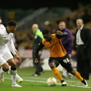 Wolves vs Derby County: Intense Battle Between Nouha Dicko and Cyrus Christie at Molineux Stadium (Sky Bet Championship)