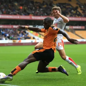 Wolves vs Huddersfield: Intense Battle for Ball Possession - Sheyi Ojo vs Martin Cranie (Sky Bet Championship) Wolves vs Huddersfield: Intense Battle for Ball Possession - Sheyi Ojo vs Martin Cranie (Sky Bet Championship)