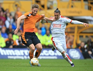 Sky Bet Championship - Wolves V Huddersfield Town - Molineux Prints: Championship Showdown: Intense Battle Between Henry and Davidson at Molineux - Wolves vs