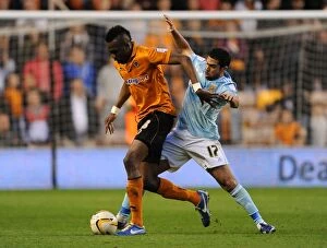 Images Dated 16th April 2013: Championship Showdown: Tongo Doumbia vs Ahmed Fathi - A Battle for Supremacy at Molineux