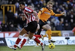 Images Dated 27th November 2010: Clash between Kevin Doyle and Anton Ferdinand: A Intense Moment in the Wolverhampton Wanderers vs