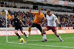 Images Dated 22nd January 2012: Clash of the Midlands: Kightly vs Agbonlahor - Wolverhampton Wanderers vs Aston Villa