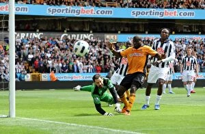 Wolves v West Bromwich Albion Collection: Clash of the Midlands Rivals: Elokobi vs. Carson - A Battle of Wolverhampton