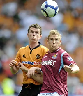 Wolves V West Ham United Prints: Clash at Molineux: A Premier League Battle - Foley vs Collison (2009)