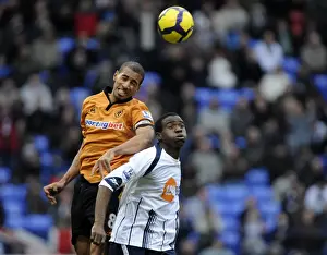Bolton V Wolves Prints: Clash on the Pitch: Henry vs. Muamba - Premier League Showdown: Wolverhampton Wanderers vs