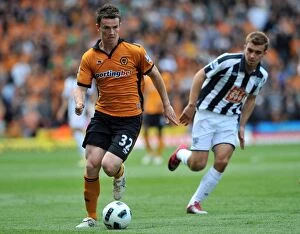 Images Dated 8th May 2011: A Clash of Rivals: Wolverhampton Wanderers vs West Bromwich Albion - Foley vs Morrison