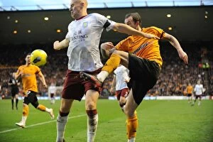 Images Dated 22nd January 2012: Clash of the Strikers: Steven Fletcher vs James Collins in Wolverhampton Wanderers vs Aston Villa