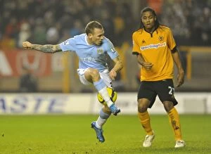 Images Dated 28th December 2009: Clash of Titans: Craig Bellamy vs Michael Mancienne - Wolves vs Manchester City in the Premier