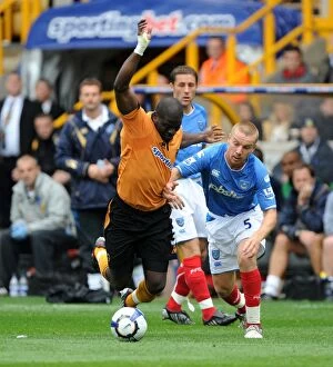 Wolves vs Portsmouth Collection: Clash of the Titans: Elokobi vs. O'Hara in Wolverhampton Wanderers vs