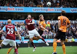 Images Dated 27th September 2010: Clash of Titans: Kevin Doyle vs Carlos Cuellar - Wolverhampton Wanderers vs Aston Villa