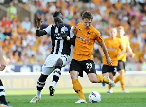 Framed Print : Clash of the Titans: Kevin Doyle vs Cheik Tiote - Wolverhampton Wanderers vs Newcastle United in the Barclays Premier League Framed Print : Clash of the Titans: Kevin Doyle vs Cheik Tiote - Wolverhampton Wanderers vs Newcastle United in the Barclays Premier League
