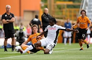 Images Dated 21st August 2011: Clash of the Titans: Kevin Doyle vs Dickson Etuhu in Wolverhampton Wanderers vs Fulham Premier