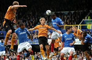 Images Dated 1st May 2010: Clash of Titans: Kevin Doyle vs Frederic Piquionne - Wolverhampton Wanderers vs Portsmouth