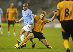 Wolves V Manchester City Prints: Clash of Titans: Nigel de Jong vs