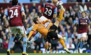 Images Dated 20th March 2010: Collins vs. Doyle: A Football Rivalry in the Barclays Premier League - Aston Villa vs