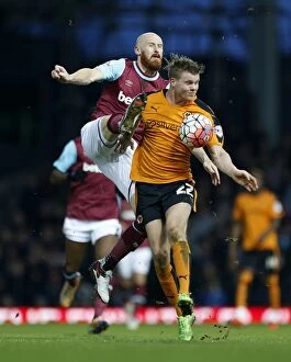 Emirates FA Cup - West Ham United v Wolves - Third Round - Upton Park Collection: Collins vs. Sigurdarson: A FA Cup Battle for Possession - Wolverhampton Wanderers vs