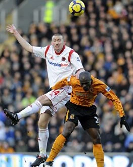 Hull v Wolves Collection: David Jones vs George Boateng: A Premier League Showdown - Hull City vs Wolverhampton Wanderers