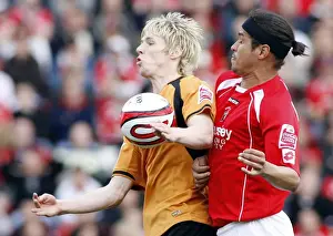 Matches 08-09 Prints: Denis Souza vs. Andrew Keogh: Championship Clash between Barnsley and Wolverhampton Wanderers