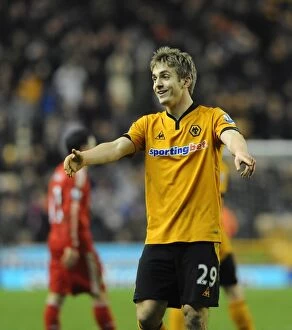 Images Dated 26th January 2010: Determined Kevin Doyle's Battle: Wolverhampton Wanderers vs Liverpool - Barclays Premier League