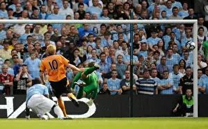 Dramatic Volley at City of Manchester Stadium: Andrew Keogh's Post-Hit Missile for Wolverhampton Wanderers vs. Manchester City, Premier League (August 22, 2009)