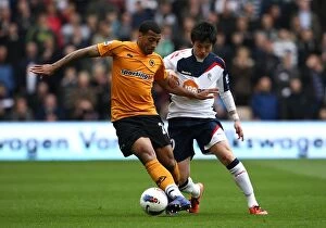 Wolves v Bolton Wanderers Collection: Ferocious Battle for Ball Possession: Wolverhampton Wanderers vs