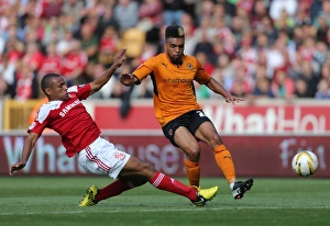 Sky Bet League One : Wolves V Swindon Town : Molineux : 14-09-2013 Prints: Fierce Rivalry: Golbourne vs Thompson Clash in Wolverhampton Wanderers vs Swindon Town's Sky Bet League One Battle