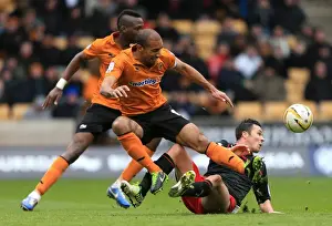 Season 2012-13 Prints: Henry vs. Cowie: Intense Rivalry in Wolverhampton Wanderers vs