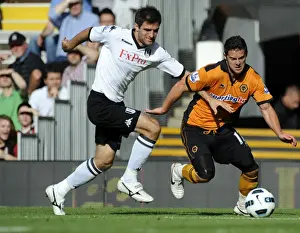 Framed Print : Intense Battle: Matt Jarvis vs Aaron Hughes - Fulham vs Wolverhampton Wanderers in the Barclays Premier League