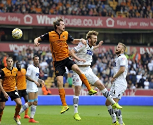 Sky Bet Championship - Wolves V Bolton Wanderers - Molineux Prints: Intense Header Battle: Stearman vs. Ream at Molineux - Sky Bet Championship Showdown